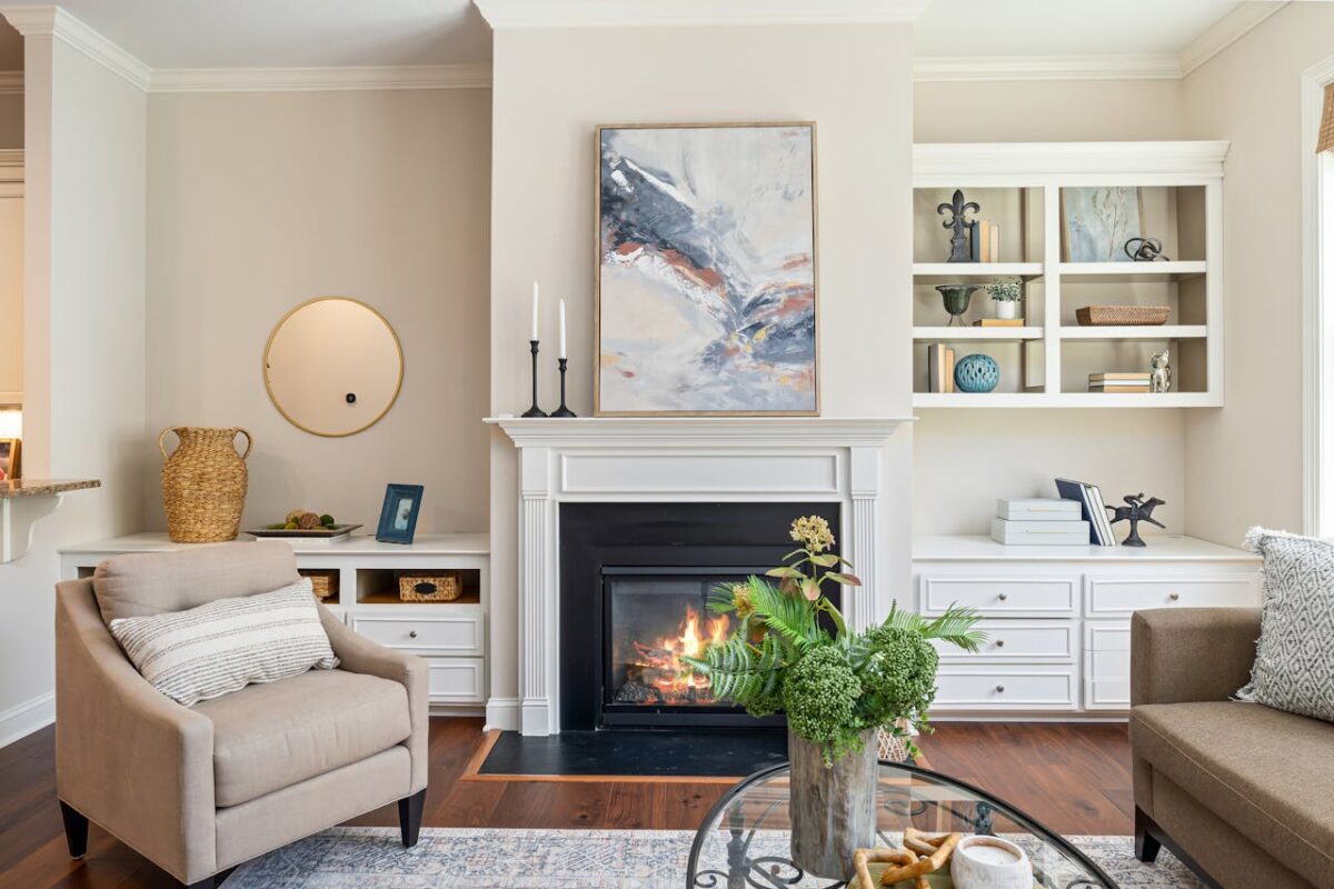about-us-01 Elegant living room featuring a modern fireplace, art, and stylish furniture for a cozy ambiance.