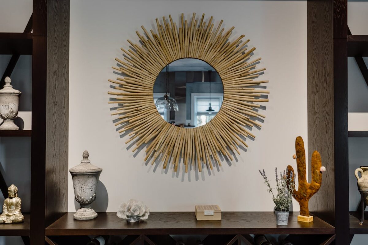 services-03 Contemporary living room featuring a unique sunburst mirror and chic decor accents.